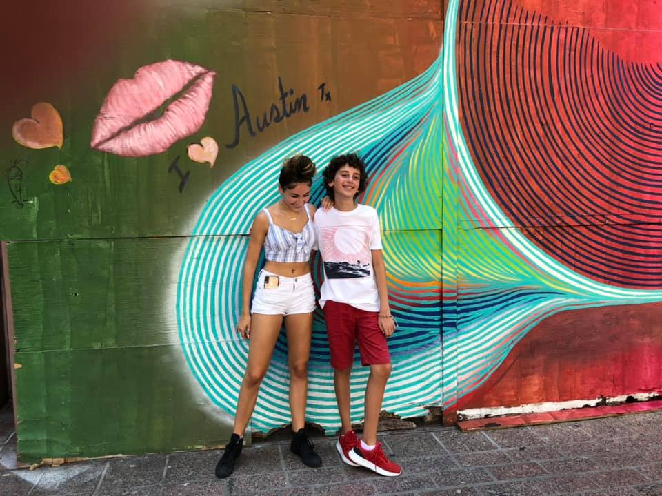 Chiara and Julian by the Austin mural, downtown.