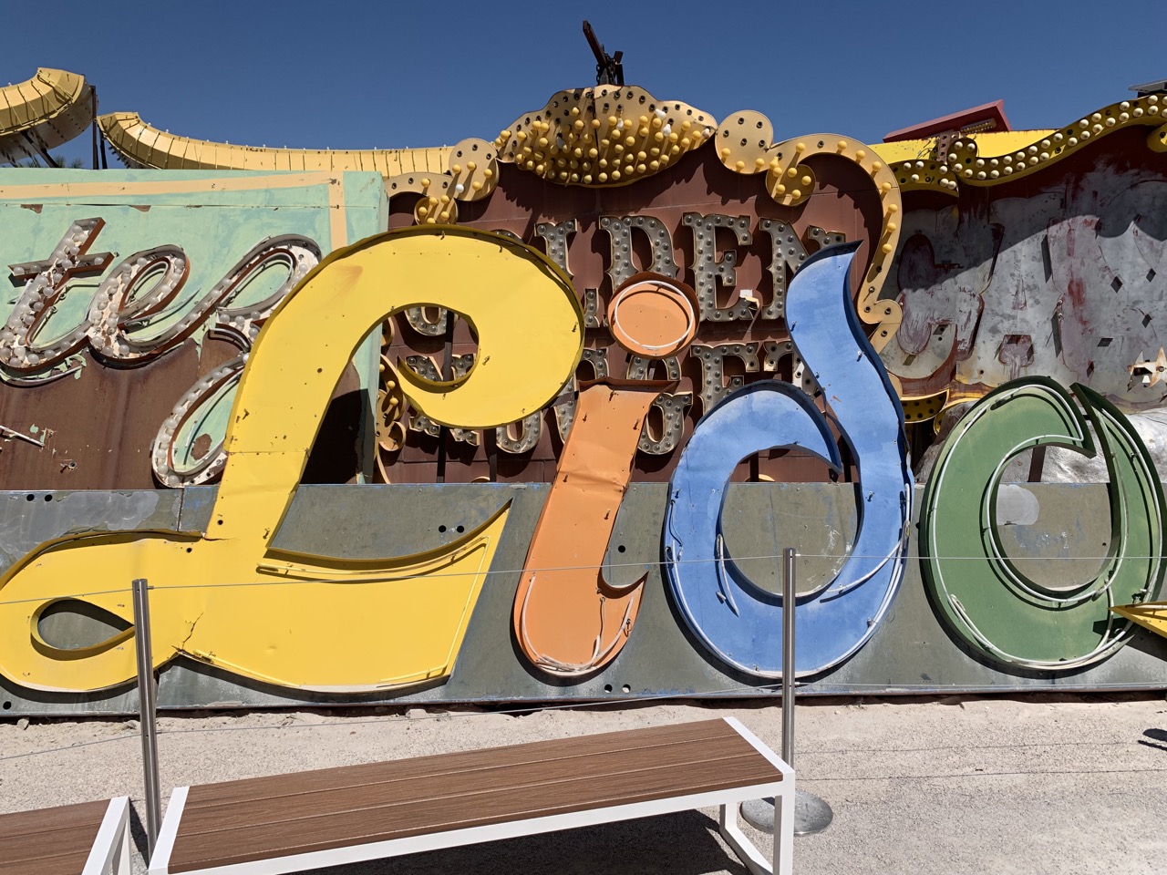 Colorful old neon signs fill the Neon Museum yard.