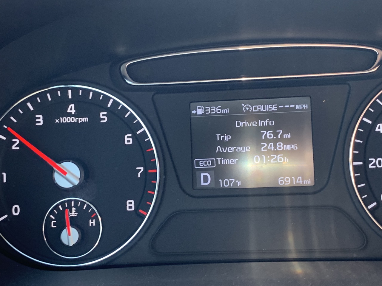 Dashboard thermometer confirms 107 degrees outside.