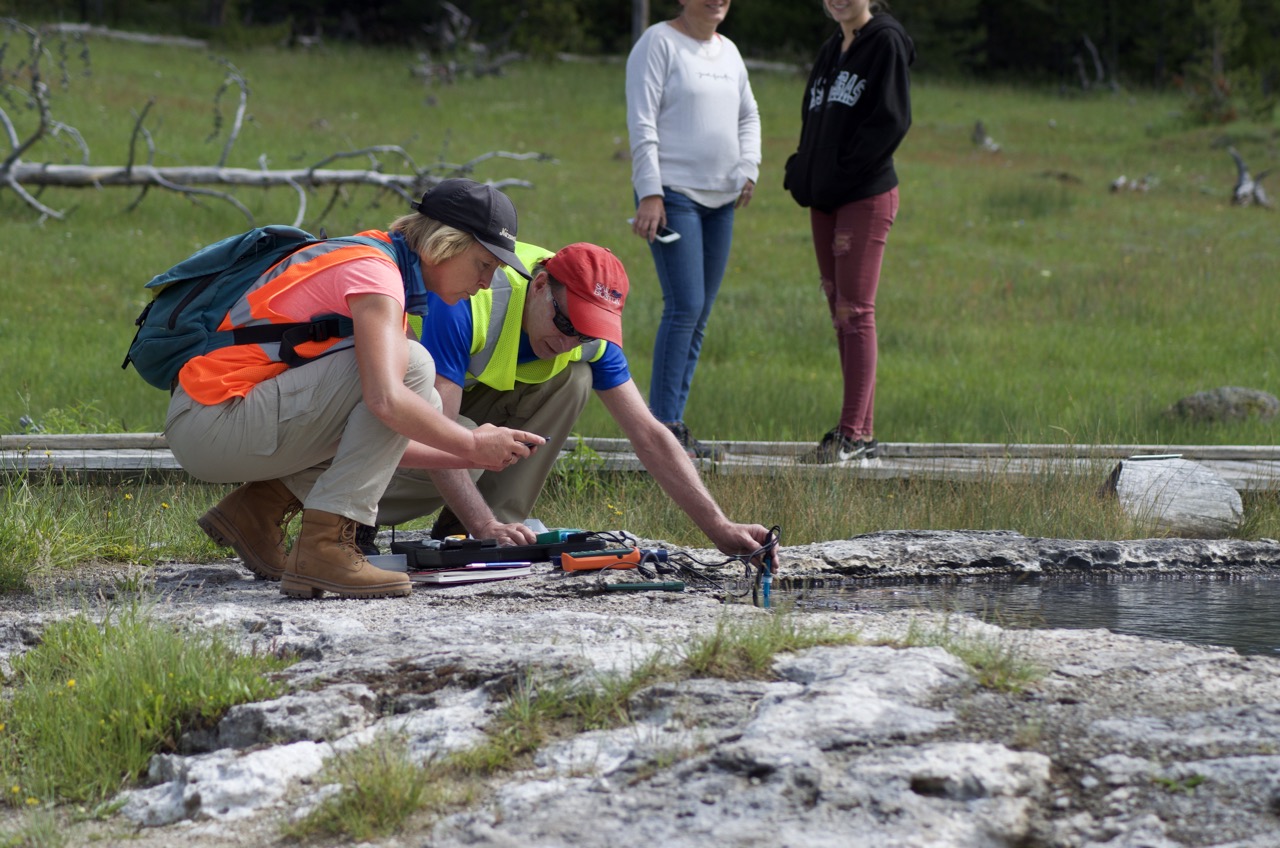 Scientists taking measurements.