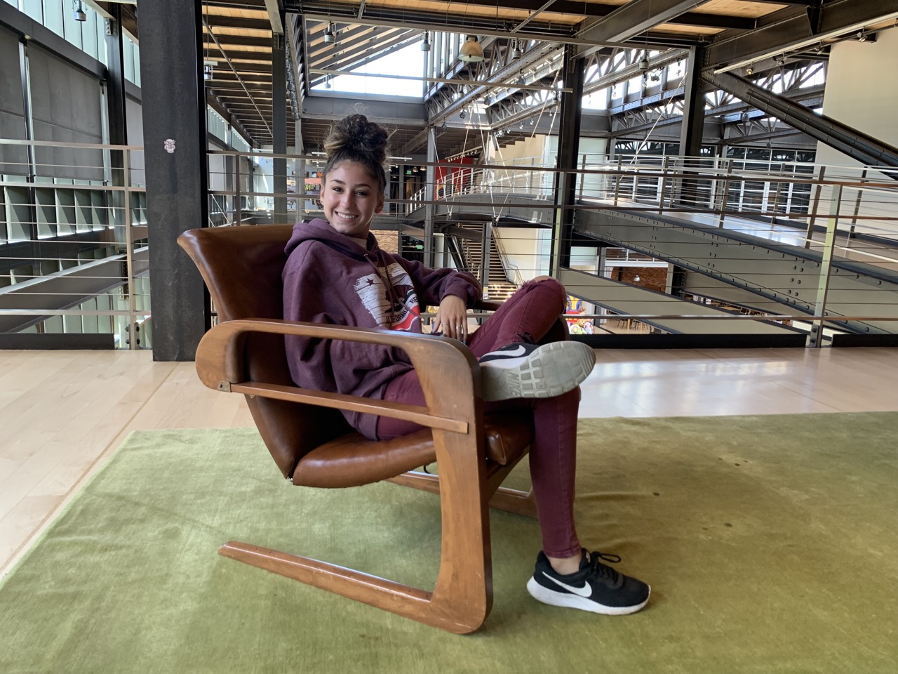 Chiara sits in a chair that was once in Walt Disney's waiting area.