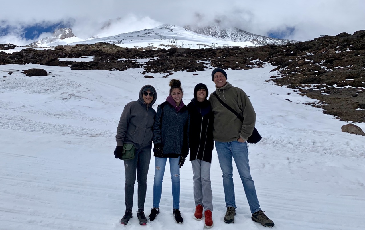 Family in the snow on Mount Hood.