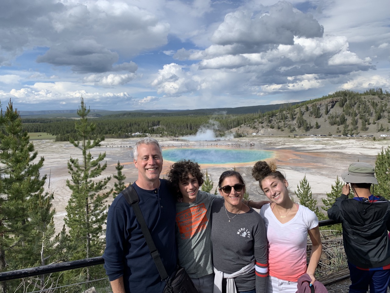 Family from the higher observation level near Grand Prismatic Spring.