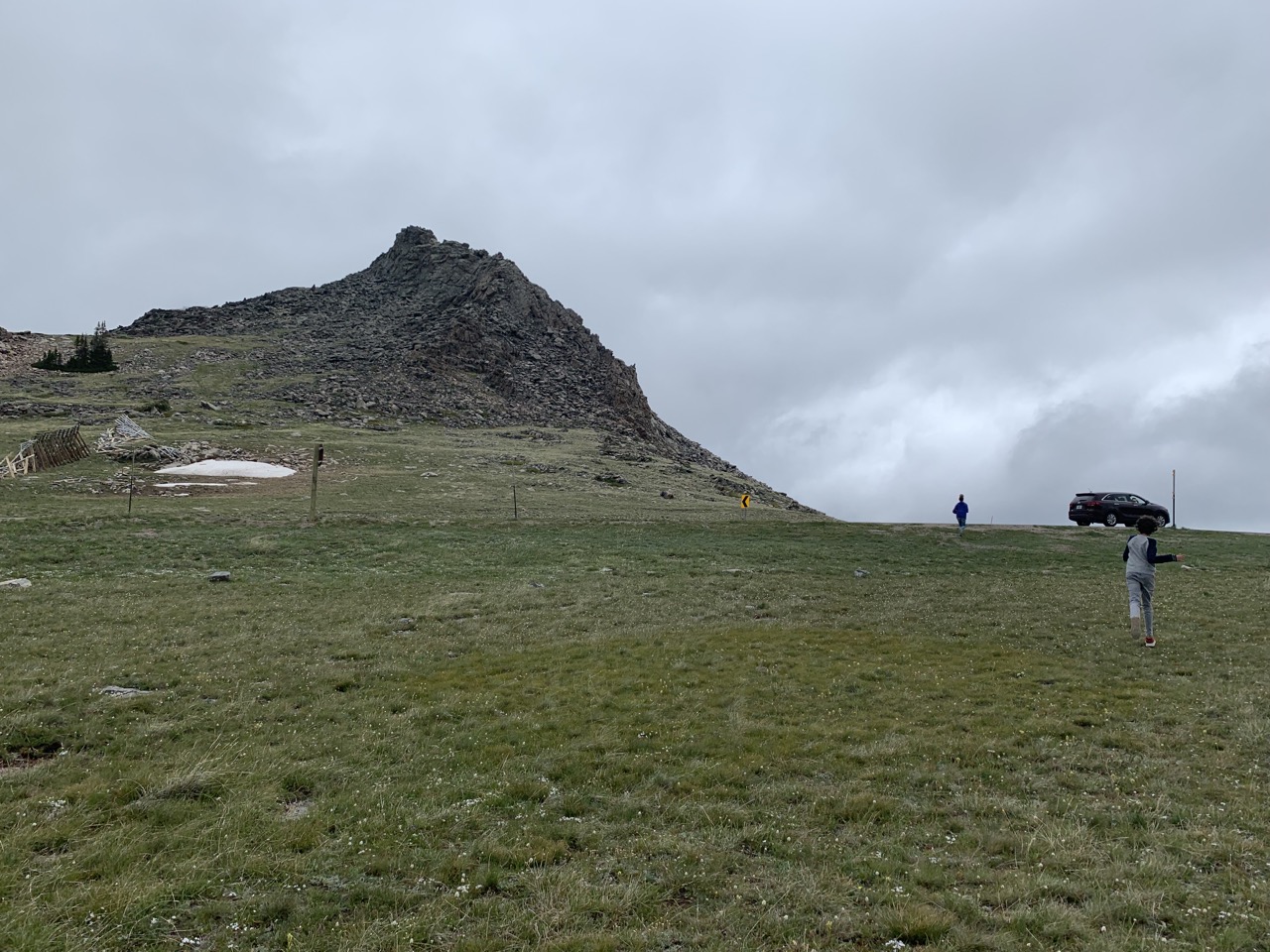 The kids running back to the car after a harrowing three minutes of 42 degree temperatures in July, at Beartooth Pass, Wyoming.