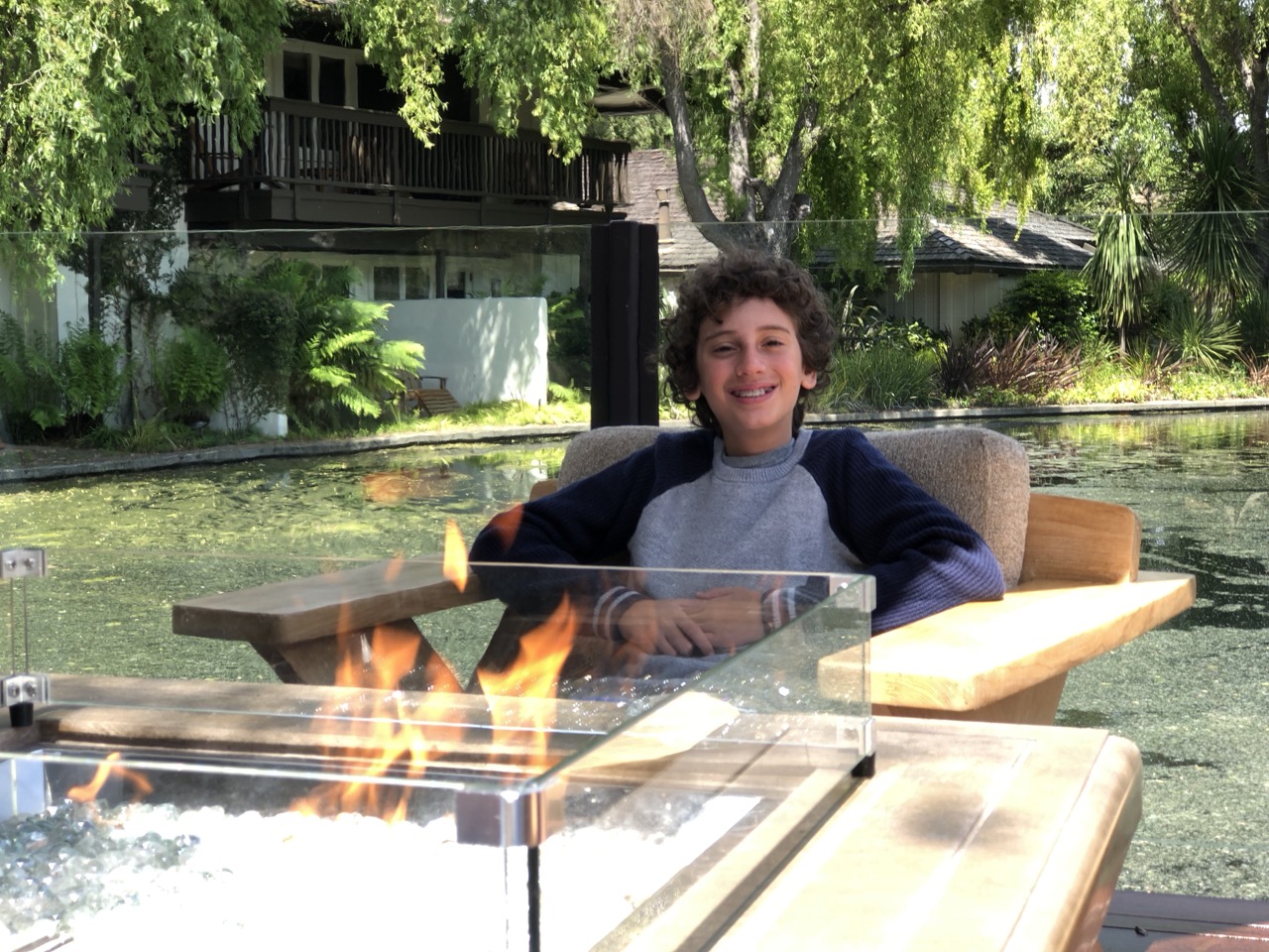 Julian relaxing by the outdoor fire at Quail Lodge and Golf Club.