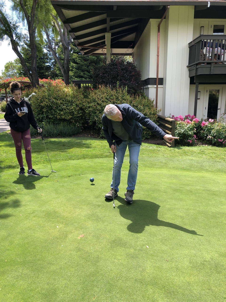 Patrick lining up a putt.