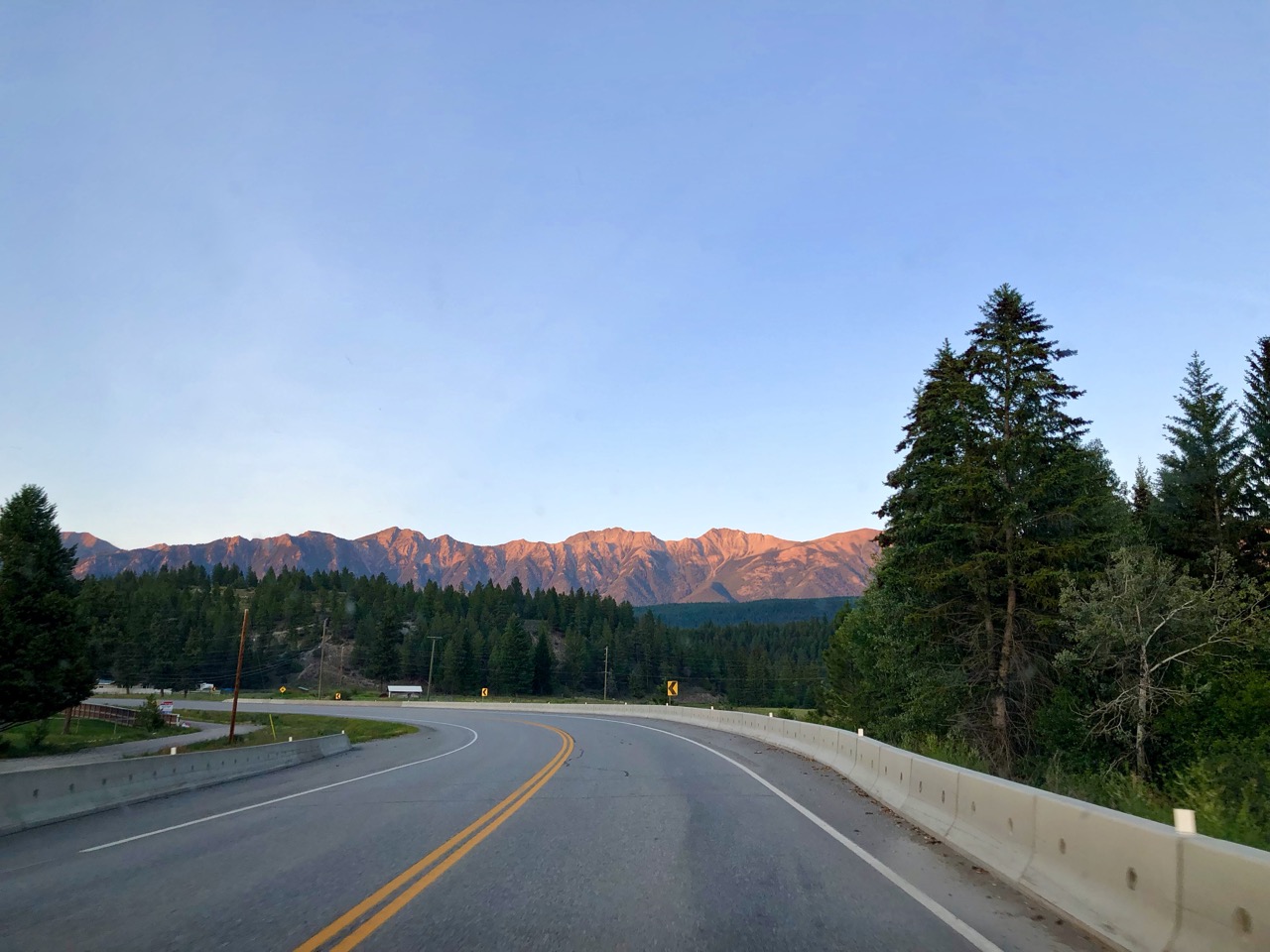 Slowly setting sun illuminates the mountains in Alberta, Canada.